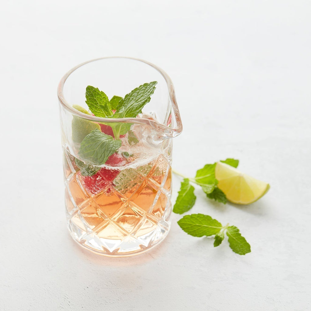 Refreshing cocktail with strawberry, lime & mint