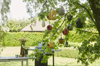Vogelhuisje uit bamboevezel eikel okergeel